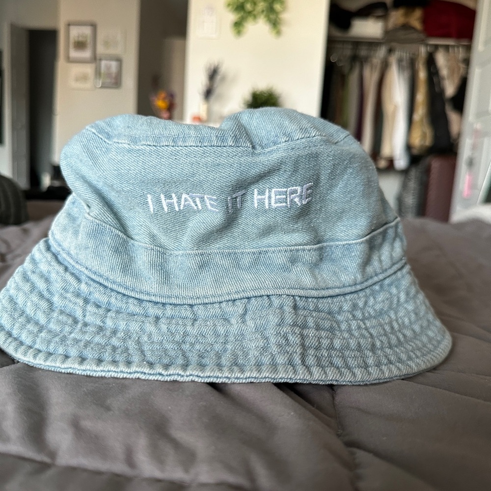 Intentionally blank denim blue bucket hat "i hate it here"
